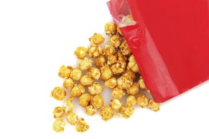 a bag of caramel corn tipped on its side